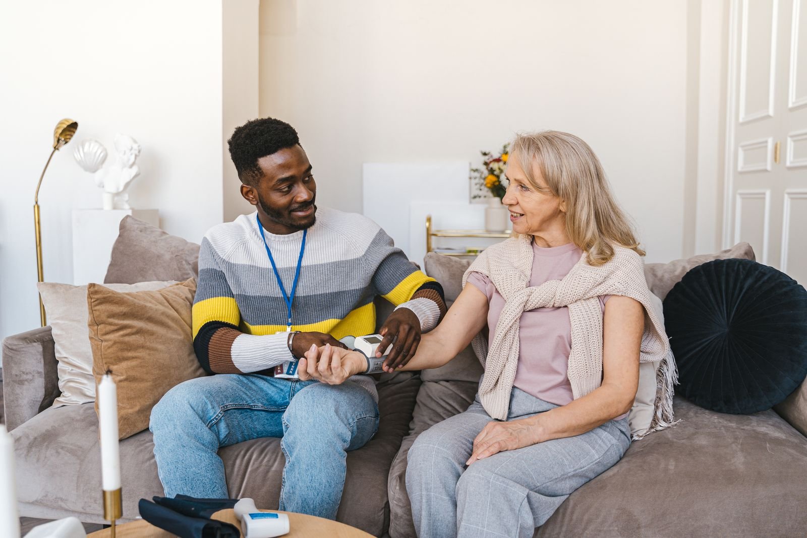 Caregiver checking on a hospice patient at home
