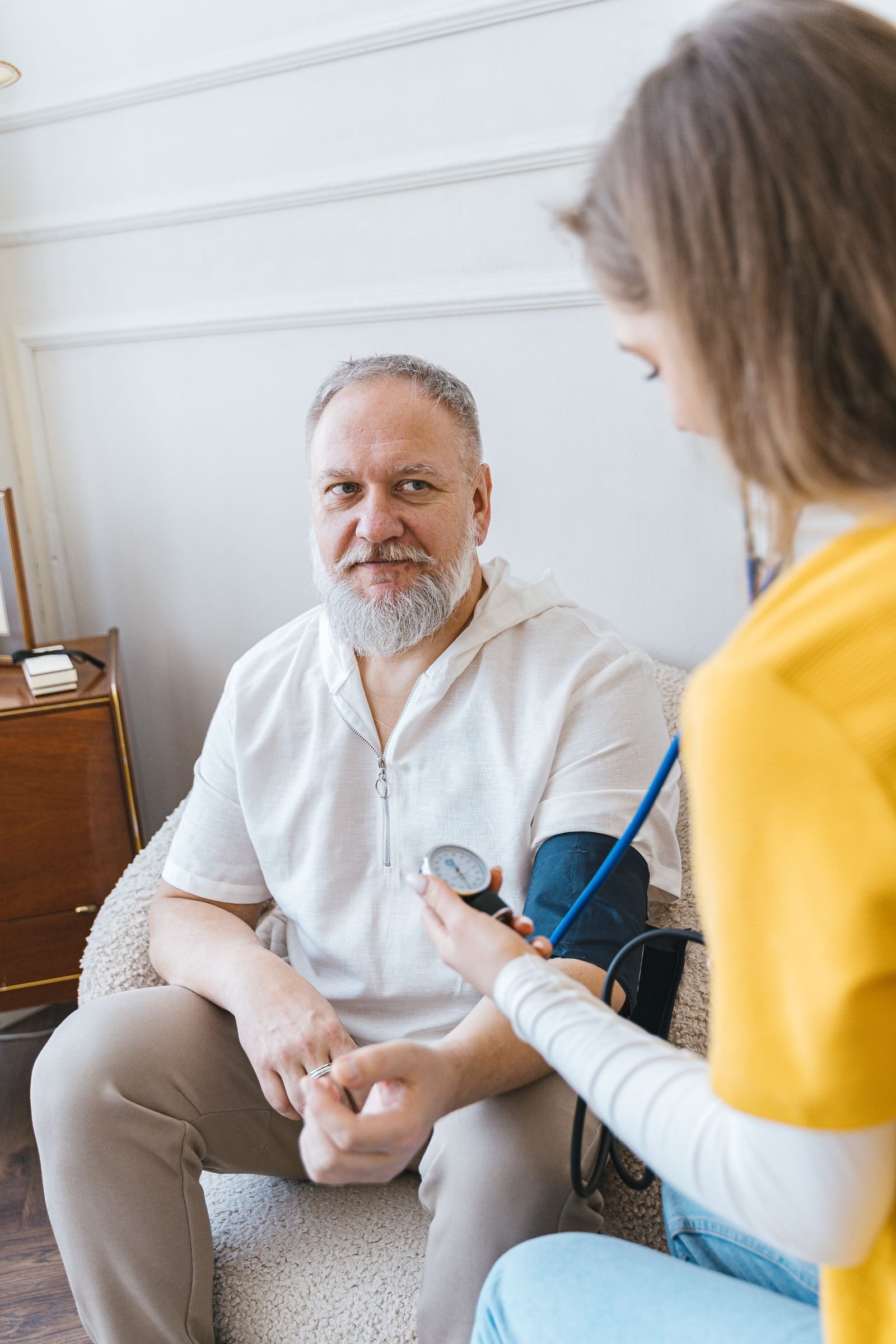 Nurse monitoring a hospice patient's vital signs